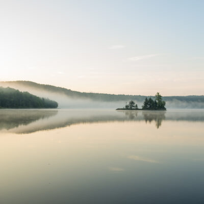 Sunrise paddling on Lake Ninevah in Mount Holly, Vermont.