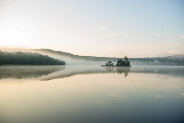 Sunrise paddling on Lake Ninevah in Mount Holly, Vermont.