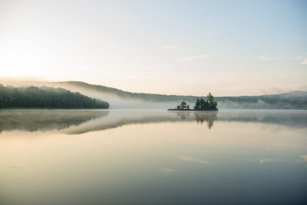 Sunrise paddling on Lake Ninevah in Mount Holly, Vermont.