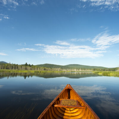 Wood and canvas canoe on the Clyde River on the Northern Forest Canoe Trail, Charleston, Vermont.