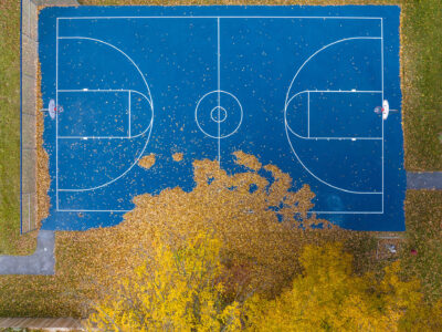 Blue basketball court and yellow fall foliage, East Middlebury, Vermont