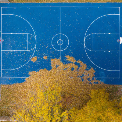 Blue basketball court and yellow fall foliage, East Middlebury, Vermont