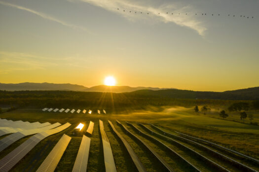 Sudbury, Vermont Sunrise over solar panels, Sudbury, Vermont